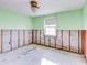 A bedroom under renovation, with walls and flooring removed at 4235 Stratford Dr, New Port Richey, FL 34652