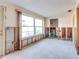 Dining room with large windows and exposed walls during a renovation at 4235 Stratford Dr, New Port Richey, FL 34652