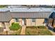 Condo unit entrance with walkway and landscaping at 4235 Stratford Dr, New Port Richey, FL 34652