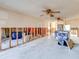 A living room with exposed walls and a bathtub visible during a renovation at 4235 Stratford Dr, New Port Richey, FL 34652