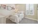 Cozy bedroom with a queen-size bed, built-in shelves, and window shutters at 4242 Isonzo Way, Wesley Chapel, FL 33543