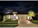 Beautiful home exterior at night at 4242 Isonzo Way, Wesley Chapel, FL 33543