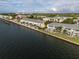 Aerial view of waterfront community showcasing numerous buildings and landscaping at 4890 Coquina Key Se Dr # B, St Petersburg, FL 33705