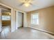 Bedroom with tile floors, closet, and ceiling fan at 569 Dixie Hwy, Tarpon Springs, FL 34689