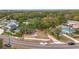 Aerial view of a residential neighborhood with trees and houses at 569 Dixie Hwy, Tarpon Springs, FL 34689