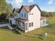 Modern two-story home with a brown roof, white exterior, and a small front yard at 6303 Barton Rd, Plant City, FL 33565