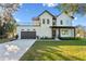 Stunning two-story home with balcony, large windows, well manicured lawn, and attached two car garage at 6303 Barton Rd, Plant City, FL 33565