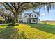 Modern two-story home featuring a spacious driveway and lush landscaping at 6303 Barton Rd, Plant City, FL 33565