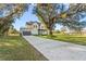 Modern two-story home featuring a spacious driveway and a two-car garage at 6303 Barton Rd, Plant City, FL 33565