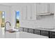 Bright kitchen featuring quartz counters, stainless appliances, and a view of the outdoor scenery at 6303 Barton Rd, Plant City, FL 33565