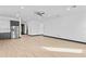 Open-concept living room with wood flooring, recessed lighting, and neutral colored walls at 6303 Barton Rd, Plant City, FL 33565