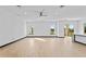 Open-concept living room with a ceiling fan, recessed lighting, and a sliding glass door to the backyard at 6303 Barton Rd, Plant City, FL 33565