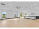 Bright living room area featuring an open floor plan, recessed lighting, and large windows at 6303 Barton Rd, Plant City, FL 33565