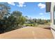 A clear view from the roof with greenery, a shed, and a blue sky at 6303 Barton Rd, Plant City, FL 33565