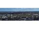 An aerial view showcasing a residential neighborhood with the city skyline in the background at 6400 46Th N Ave # 105, Kenneth City, FL 33709