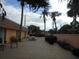 Community patio area with picnic tables at 6400 46Th N Ave # 105, Kenneth City, FL 33709