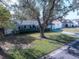 Elevated perspective of a house with a large oak tree in the front yard at 6426 29Th N Ave, St Petersburg, FL 33710