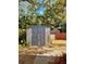 Gray plastic storage shed in the backyard at 6951 19Th N Way, St Petersburg, FL 33702