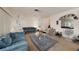 Living room with blue sofas, a coffee table, and a Christmas tree at 7507 Meadow Dr, Tampa, FL 33634