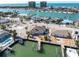 Aerial view highlighting waterfront location, dock, and home exterior at 8021 Coquina Way, St Pete Beach, FL 33706