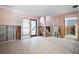 Entryway and staircase with tile flooring and decorative glass door; currently under renovation at 807 Bay Point Dr, Madeira Beach, FL 33708