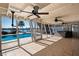 Screened-in pool and spa area overlooking the water at 807 Bay Point Dr, Madeira Beach, FL 33708