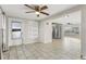 Dining area with tiled floors, ceiling fan, and built-in shelving at 9167 108Th St, Seminole, FL 33772