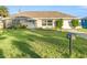House exterior showcasing a well-maintained lawn and classic design at 9167 108Th St, Seminole, FL 33772