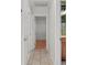 Hallway with tile flooring and doors leading to various rooms at 9167 108Th St, Seminole, FL 33772