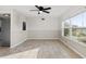 Bright living room featuring tile floors and a ceiling fan at 9167 108Th St, Seminole, FL 33772