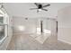 Bright living room with tiled flooring, ceiling fan, and large windows at 9167 108Th St, Seminole, FL 33772