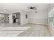 Bright living room featuring tile floors and a ceiling fan at 9167 108Th St, Seminole, FL 33772