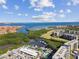 Aerial view of waterfront community, marina, and bridge at 2700 Cove Cay Dr # 2F, Clearwater, FL 33760