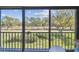 Balcony with serene golf course views and lush greenery at 2700 Cove Cay Dr # 2F, Clearwater, FL 33760
