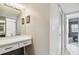 Bright bathroom with vanity and access to bedroom at 2700 Cove Cay Dr # 2F, Clearwater, FL 33760