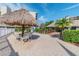 Relaxing patio area with thatched umbrella at 2700 Cove Cay Dr # 1-2F, Clearwater, FL 33760