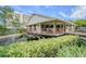 Community clubhouse with deck overlooking pond at 2700 Cove Cay Dr # 2F, Clearwater, FL 33760