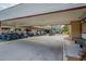 Golf carts parked under a covered area at Cove Cay at 2700 Cove Cay Dr # 2F, Clearwater, FL 33760