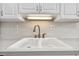 Clean white double sink with a modern faucet in the kitchen at 2700 Cove Cay Dr # 2F, Clearwater, FL 33760