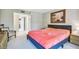 King-size bed in a spacious bedroom with access to the bathroom at 2700 Cove Cay Dr # 2F, Clearwater, FL 33760
