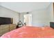 Bedroom with king bed, dresser, and a view of the bathroom at 2700 Cove Cay Dr # 2F, Clearwater, FL 33760