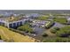 Aerial view of a marina nestled amidst lush greenery with buildings and a golf course nearby at 2700 Cove Cay Dr # 2F, Clearwater, FL 33760