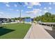 Scenic view of the marina with a boardwalk and green space at 2700 Cove Cay Dr # 2F, Clearwater, FL 33760
