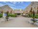 Covered patio area with thatched roof umbrellas and seating at 2700 Cove Cay Dr # 2F, Clearwater, FL 33760
