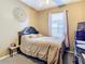 Bright bedroom with a double bed and ensuite bathroom at 10407 Goldenbrook Way, Tampa, FL 33647