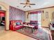 Relaxing living room with red leather couches and brick feature wall at 10407 Goldenbrook Way, Tampa, FL 33647