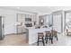 Modern kitchen with gray shaker cabinets, white countertops, and an island with bar seating at 10550 Dusty Boot Rd, Land O Lakes, FL 34638