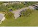 Aerial view showcasing the villa's location within a tranquil, green community at 11231 Dollar Lake Dr # 6, Port Richey, FL 34668