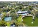 Community amenities including pool, tennis courts, and clubhouse by the lake at 11231 Dollar Lake Dr # 6, Port Richey, FL 34668