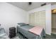 Cozy bedroom with twin bed, closet, and nightstand at 11231 Dollar Lake Dr # 6, Port Richey, FL 34668